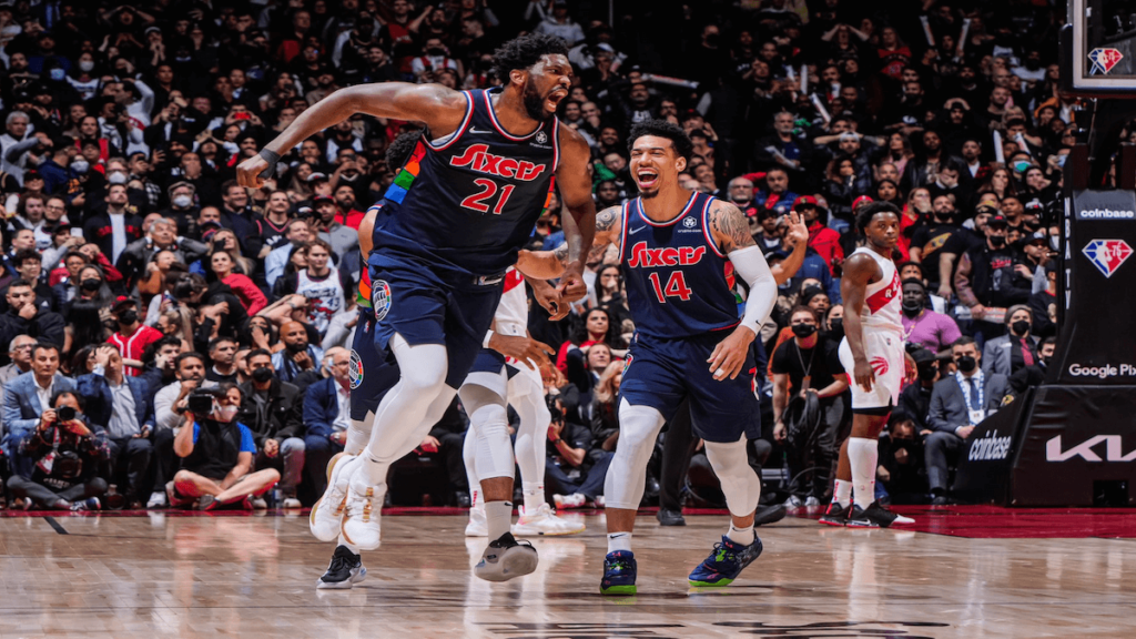 Joel Embiid and Danny Green celebrating against the Toronto Raptors