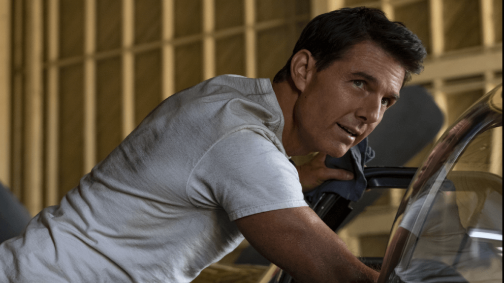 Tom Cruise fixing a bike in Top Gun Maverick